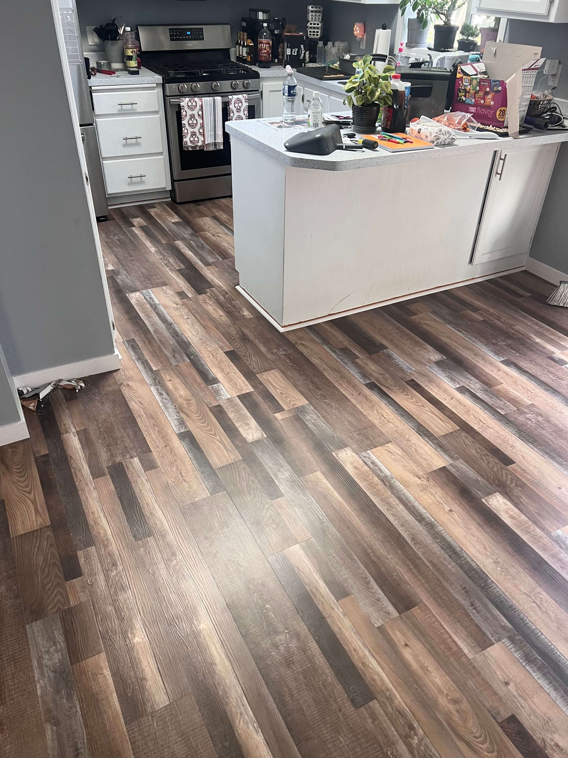 Laminate flooring installed across an open living room