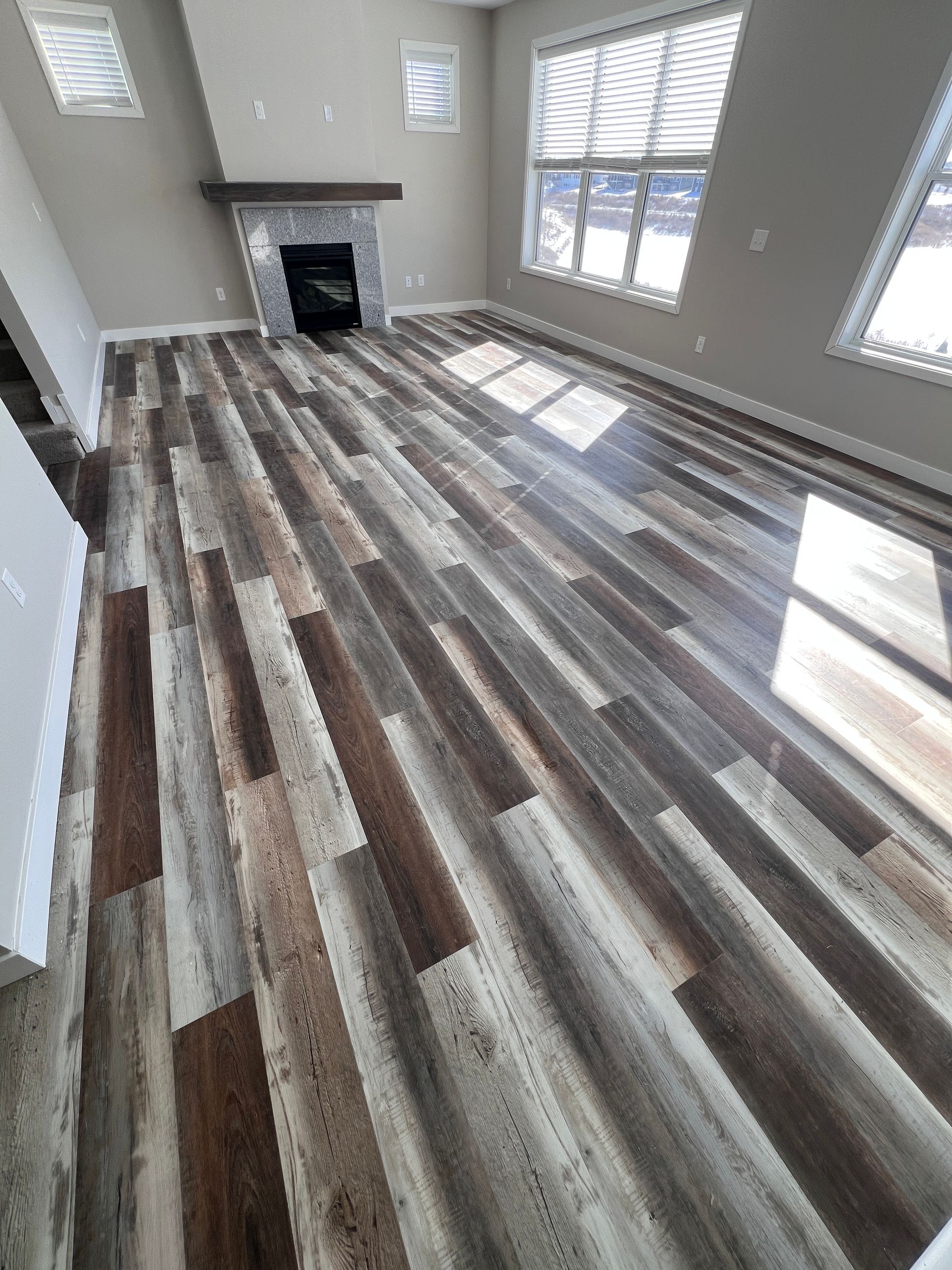 Luxury vinyl plank flooring installed through a finished hallway by Pro Floors