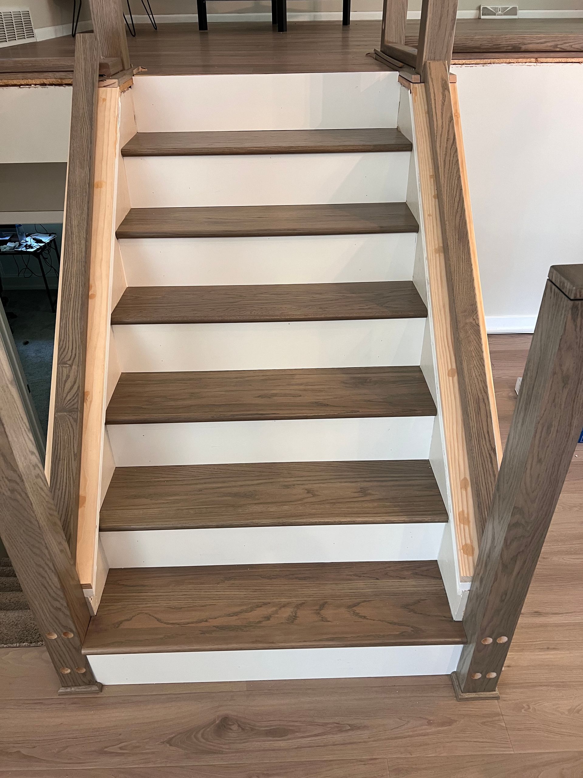 Finished staircase with new wood treads and white risers